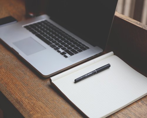 Standing up from office desk to stretch